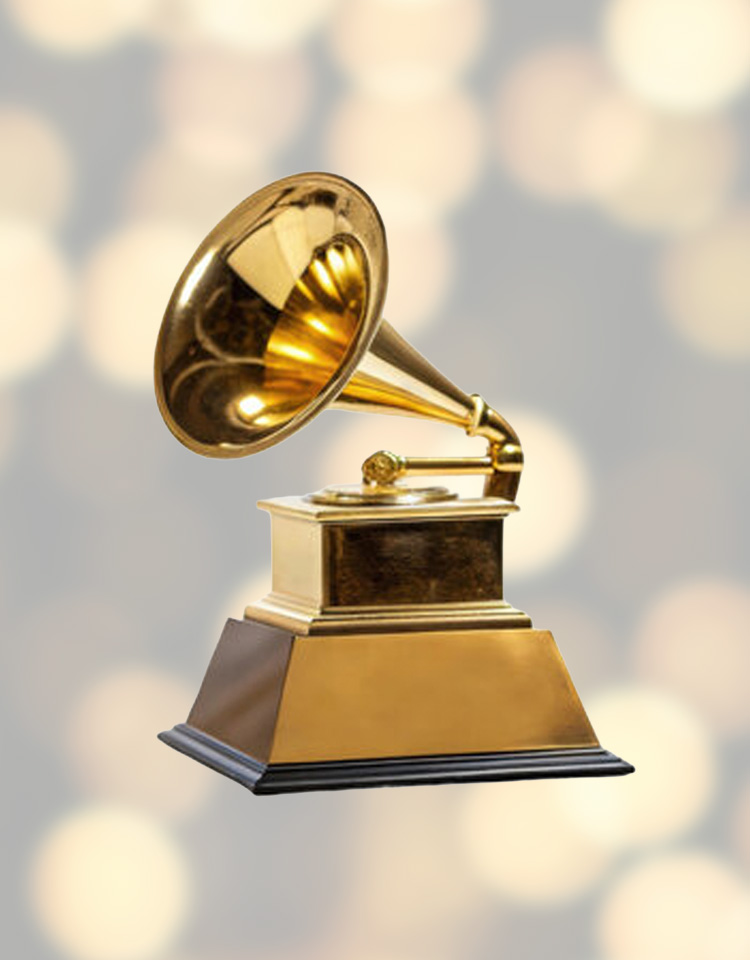 Gold plated gramophone award on gold background