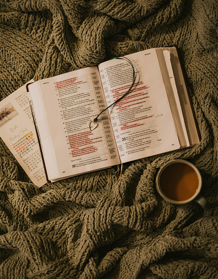an image of a bible and a planner with a cup of coffee.